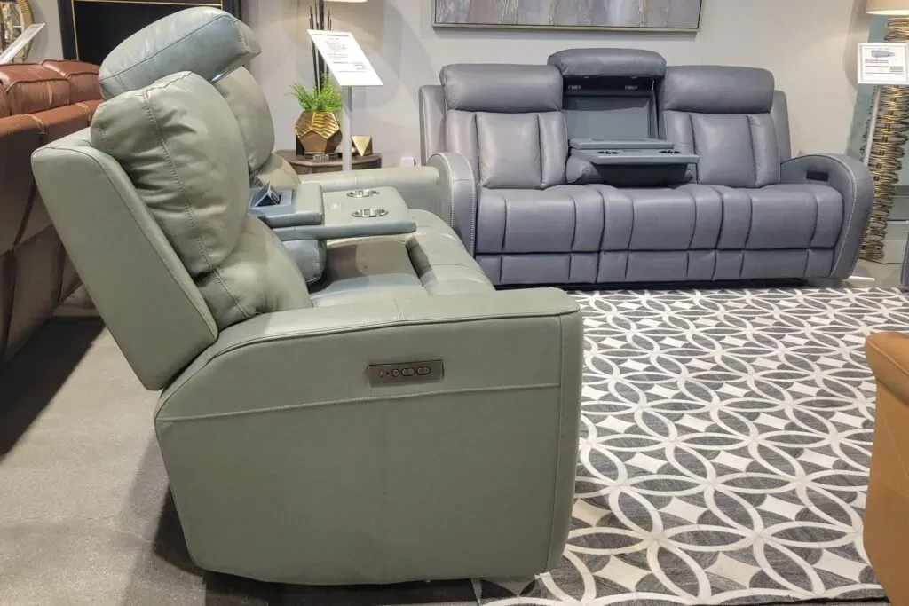Green and blue Italian leather sofas in a showroom